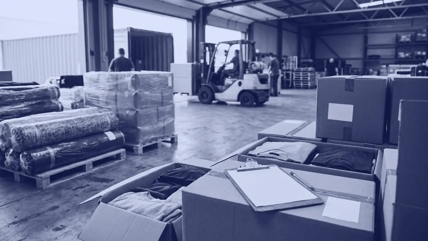 Wrapped fabric rolls and cartons on pallets, a forklift loading a container and folded garments in boxes